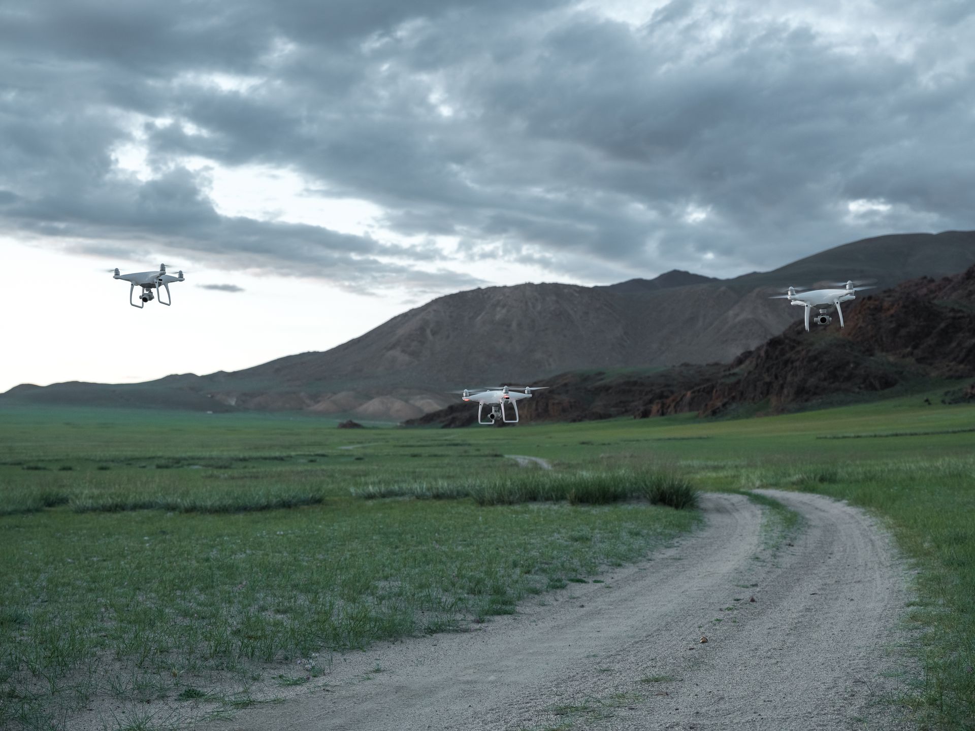 Drone in flight over mountain ridge